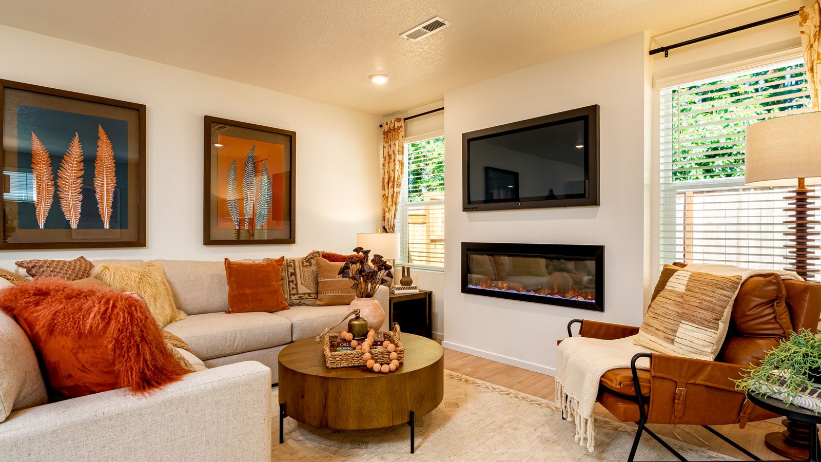 Great room with laminate flooring and an electric fireplace