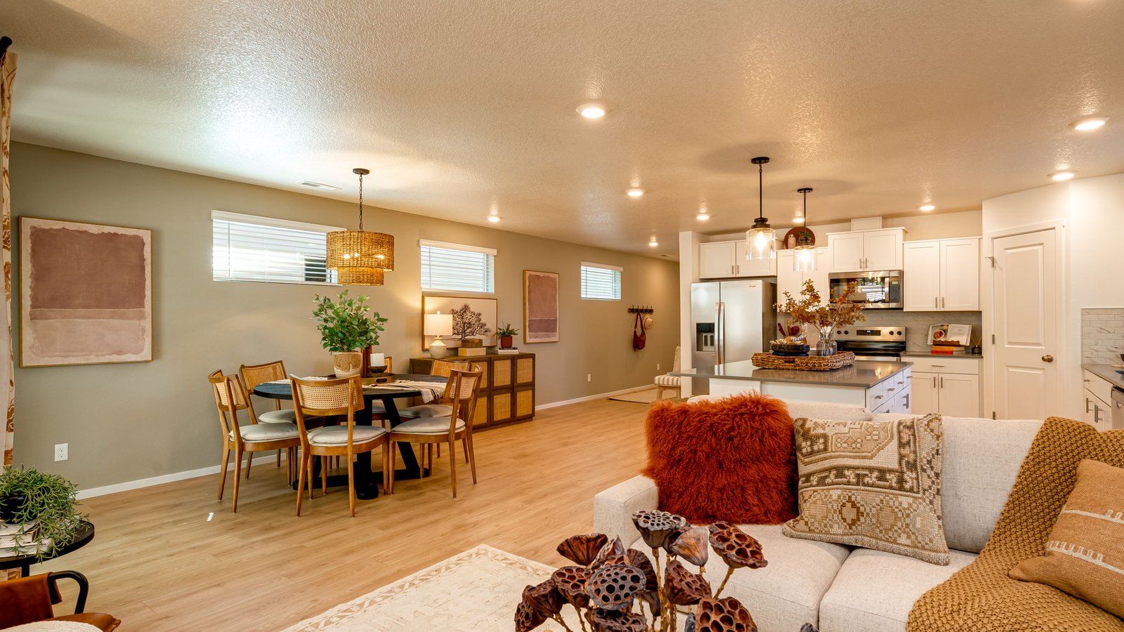 Great room with laminate flooring and an electric fireplace