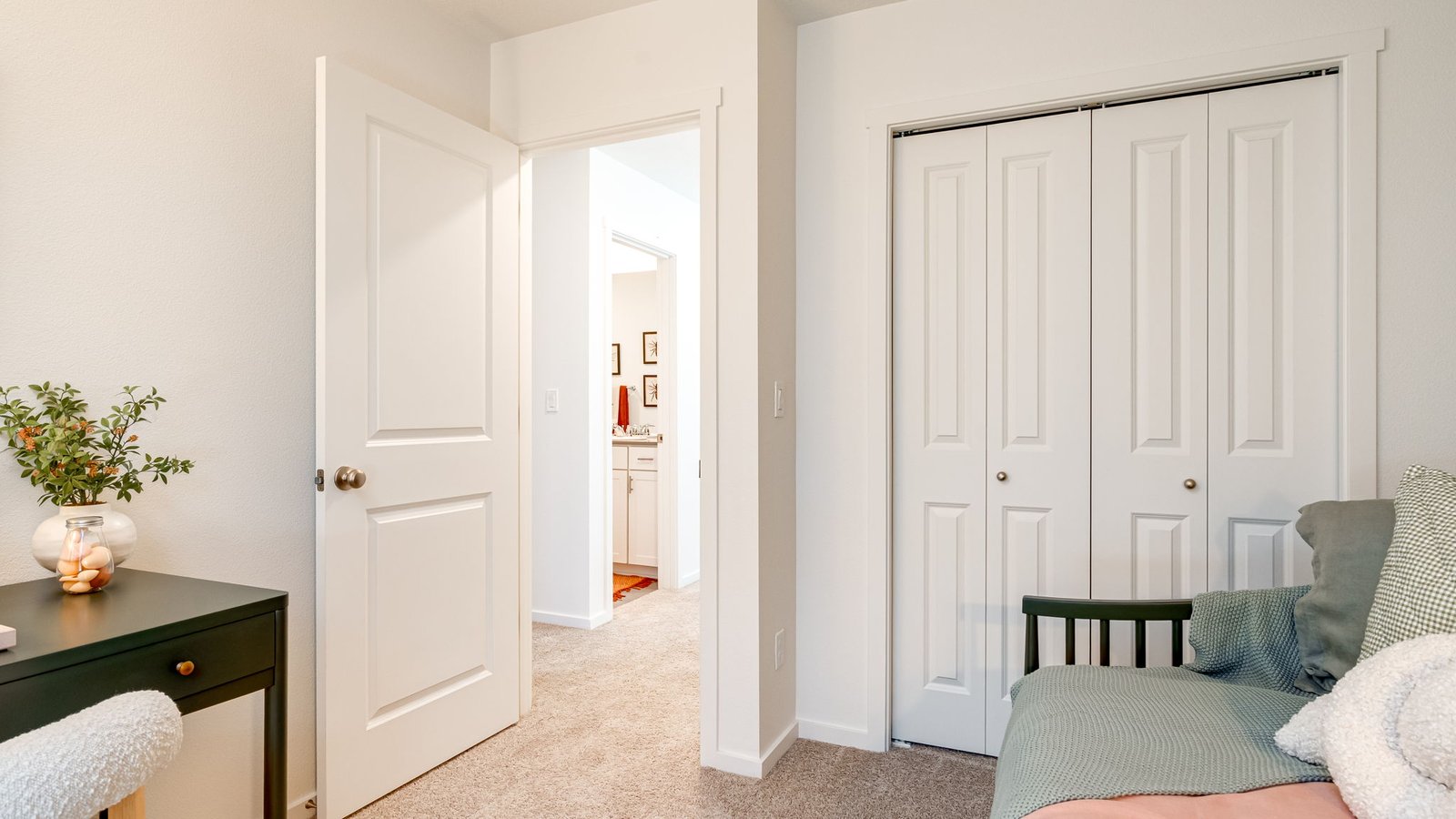Bedroom with wall-to-wall carpet and a closet