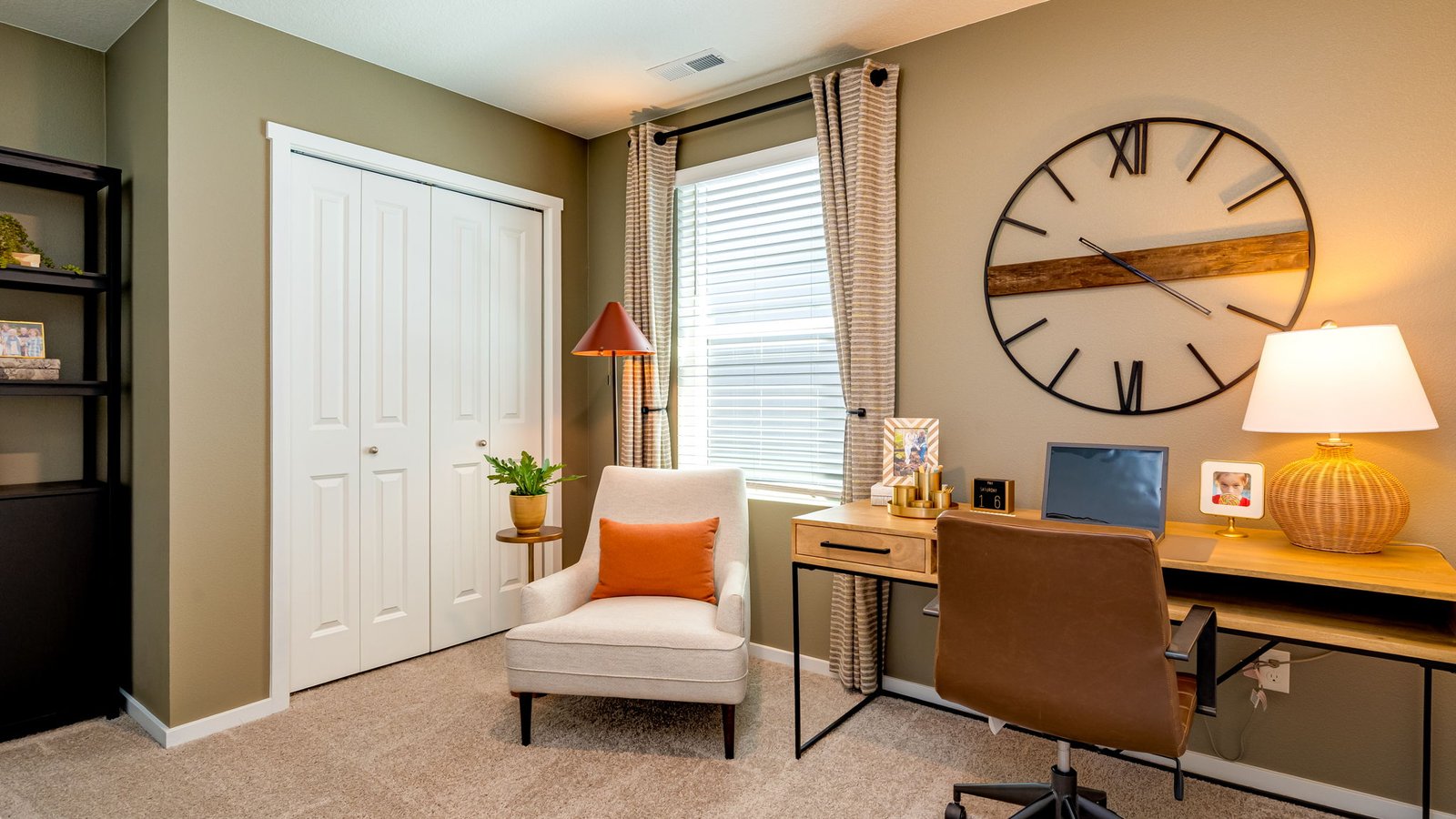 Bedroom with wall-to-wall carpet and a closet