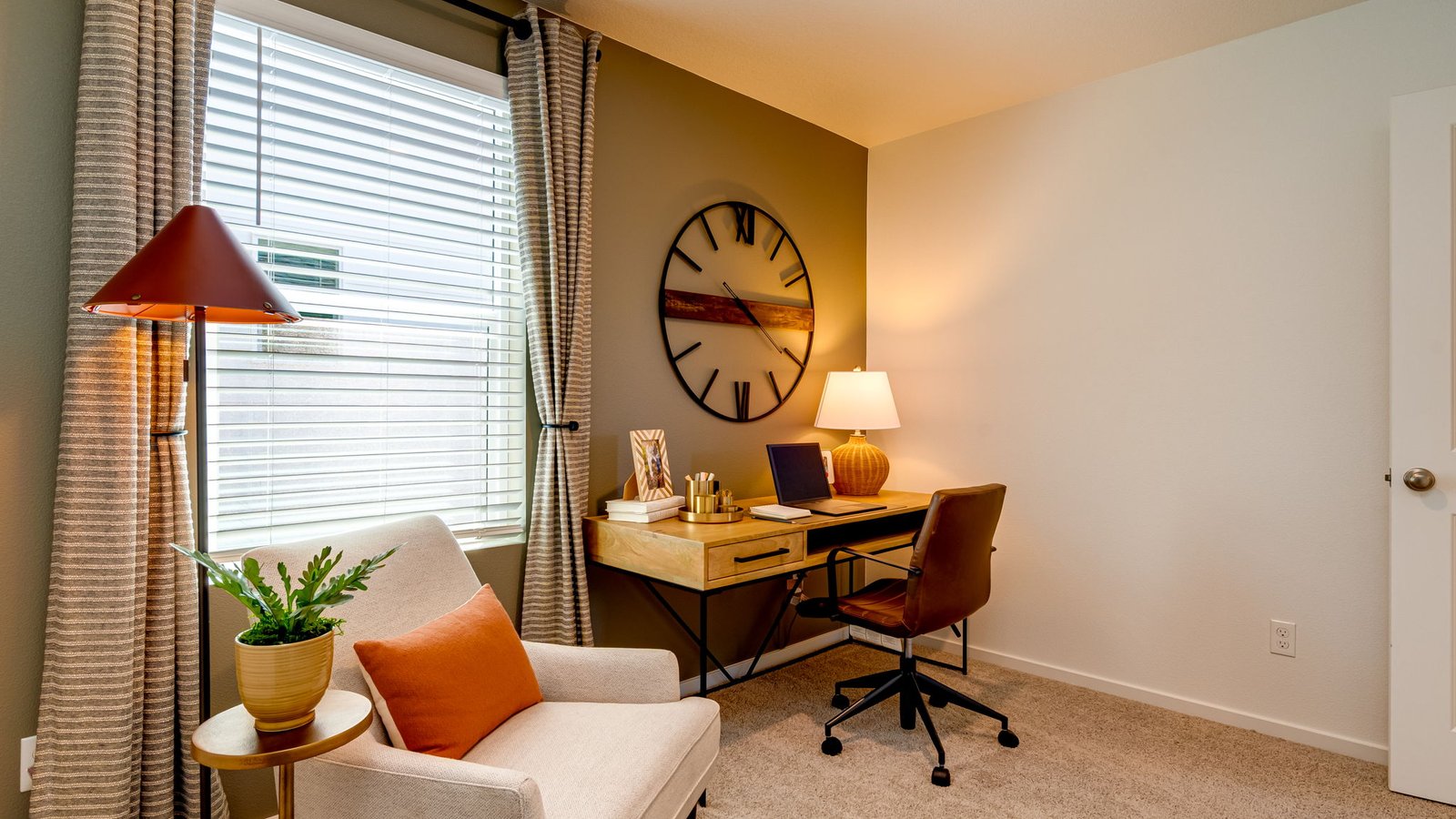 Bedroom with wall-to-wall carpet and a closet