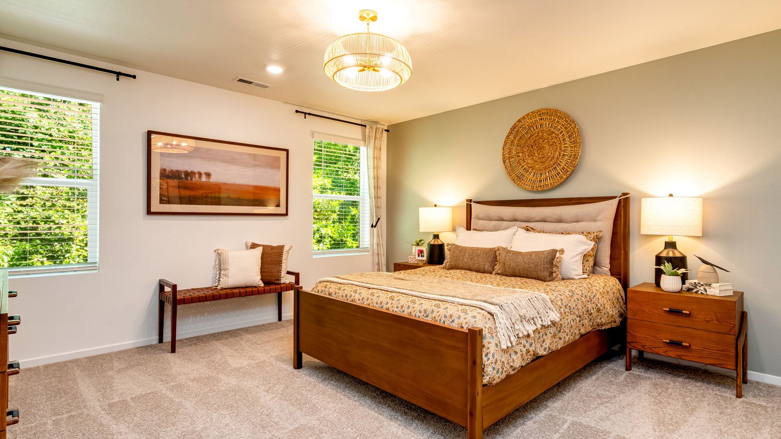Primary bedroom with wall-to-wall carpet, a walk-in closet and an attached bathroom