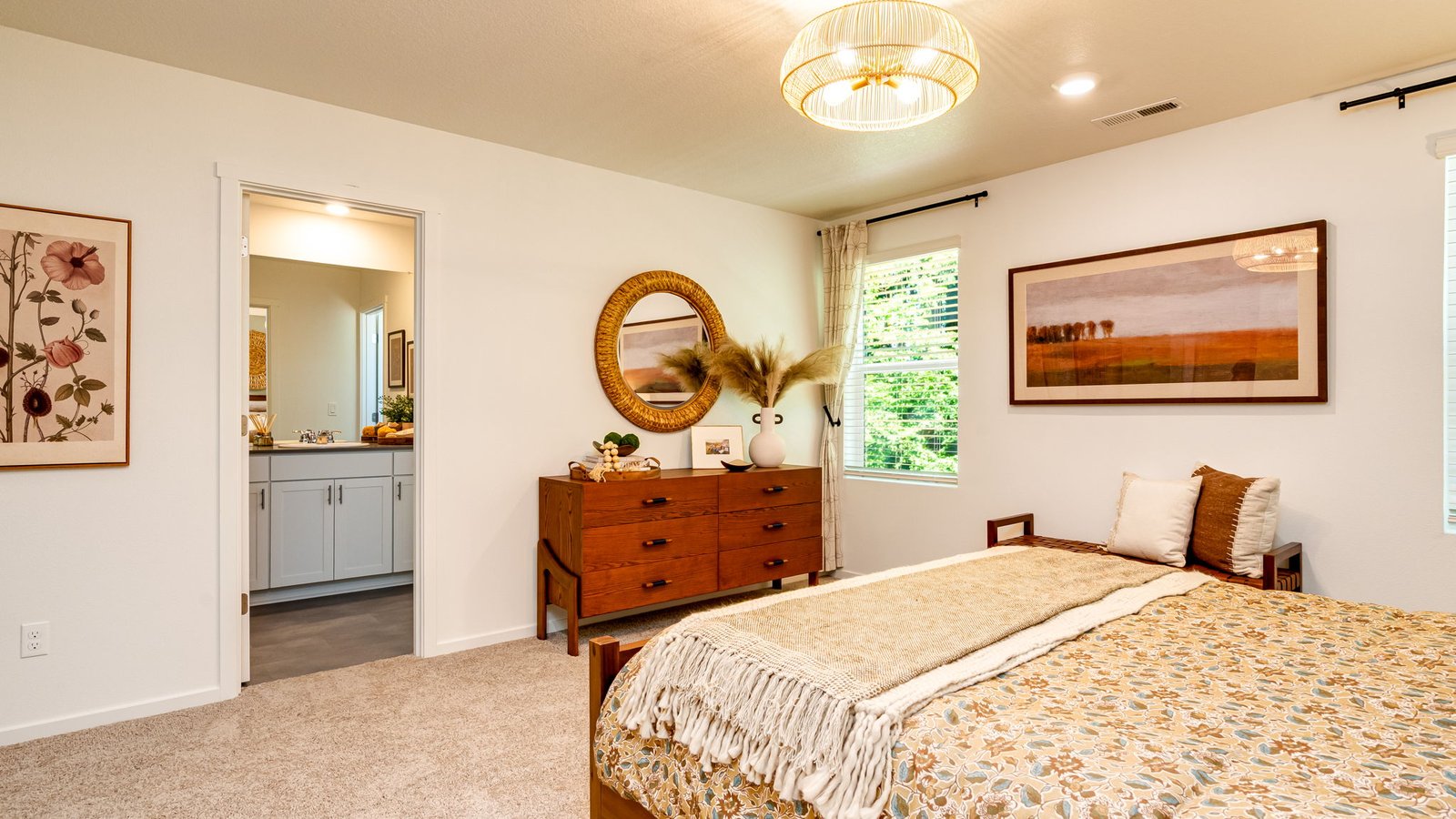 Primary bedroom with wall-to-wall carpet, a walk-in closet and an attached bathroom