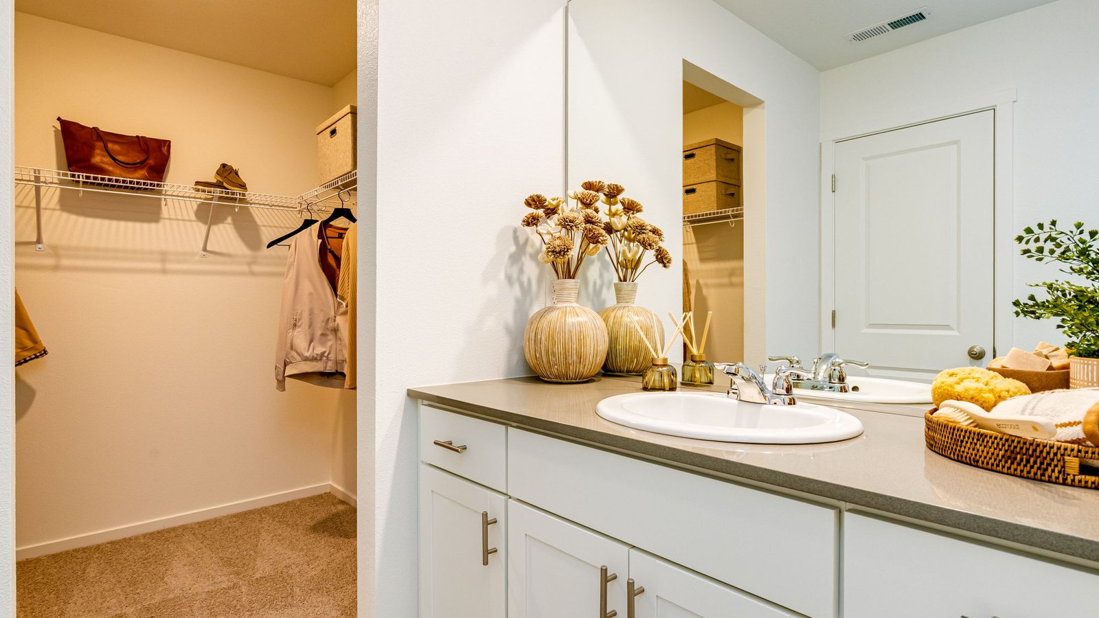 Primary bathroom with quartz counters and a walk-in shower