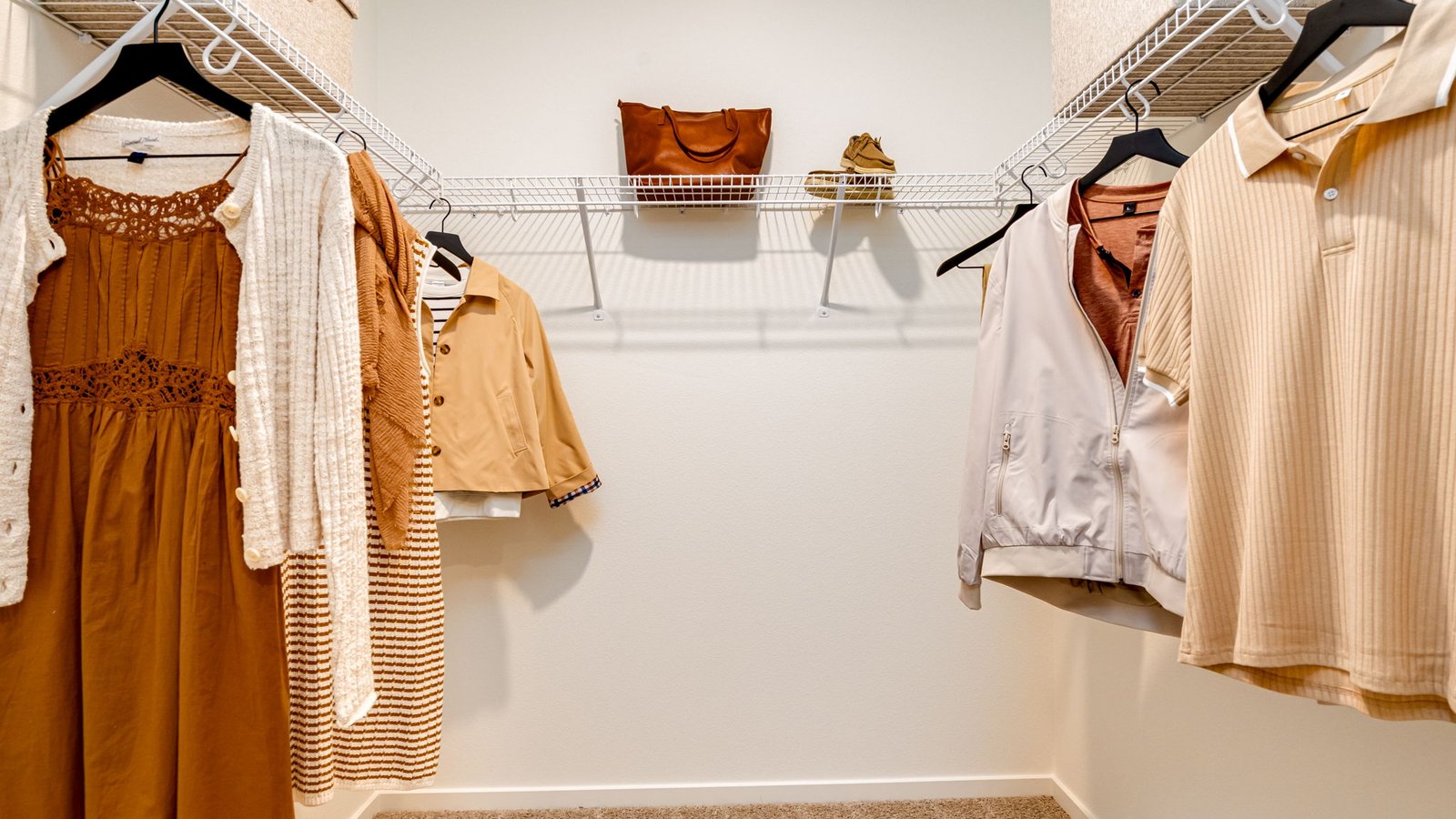 Primary bedroom walk-in closet with wire shelves