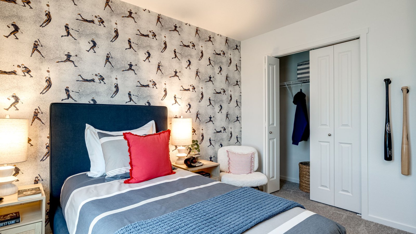 Bedroom with wall-to-wall carpet and a closet