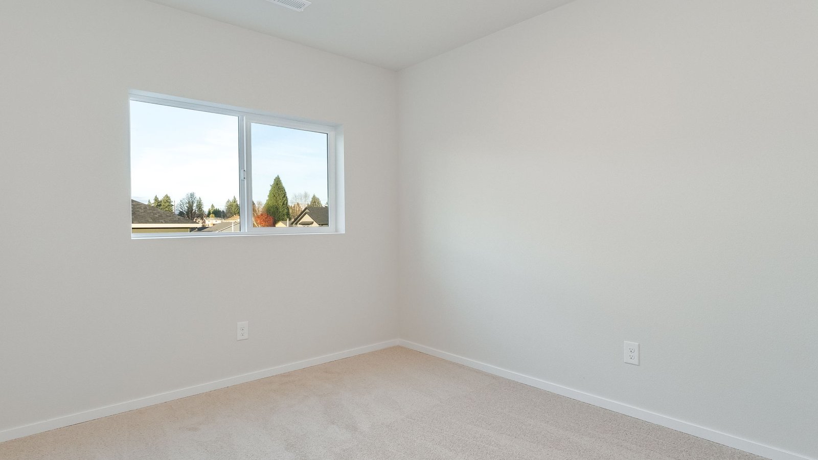 Bedroom with wall-to-wall carpet and a closet