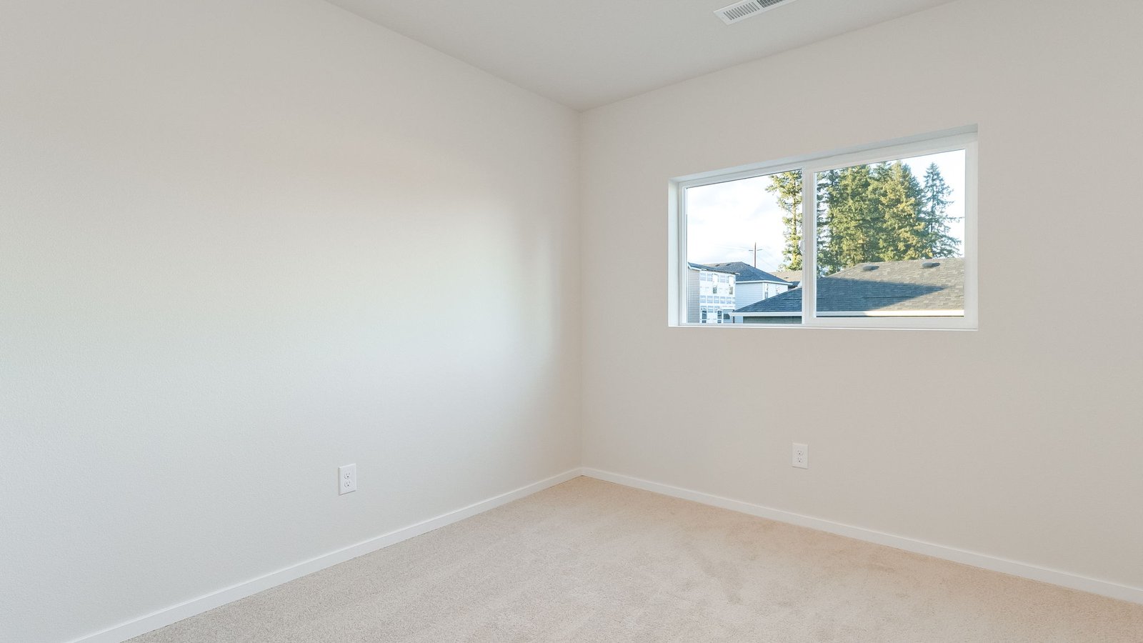 Bedroom with wall-to-wall carpet and a closet