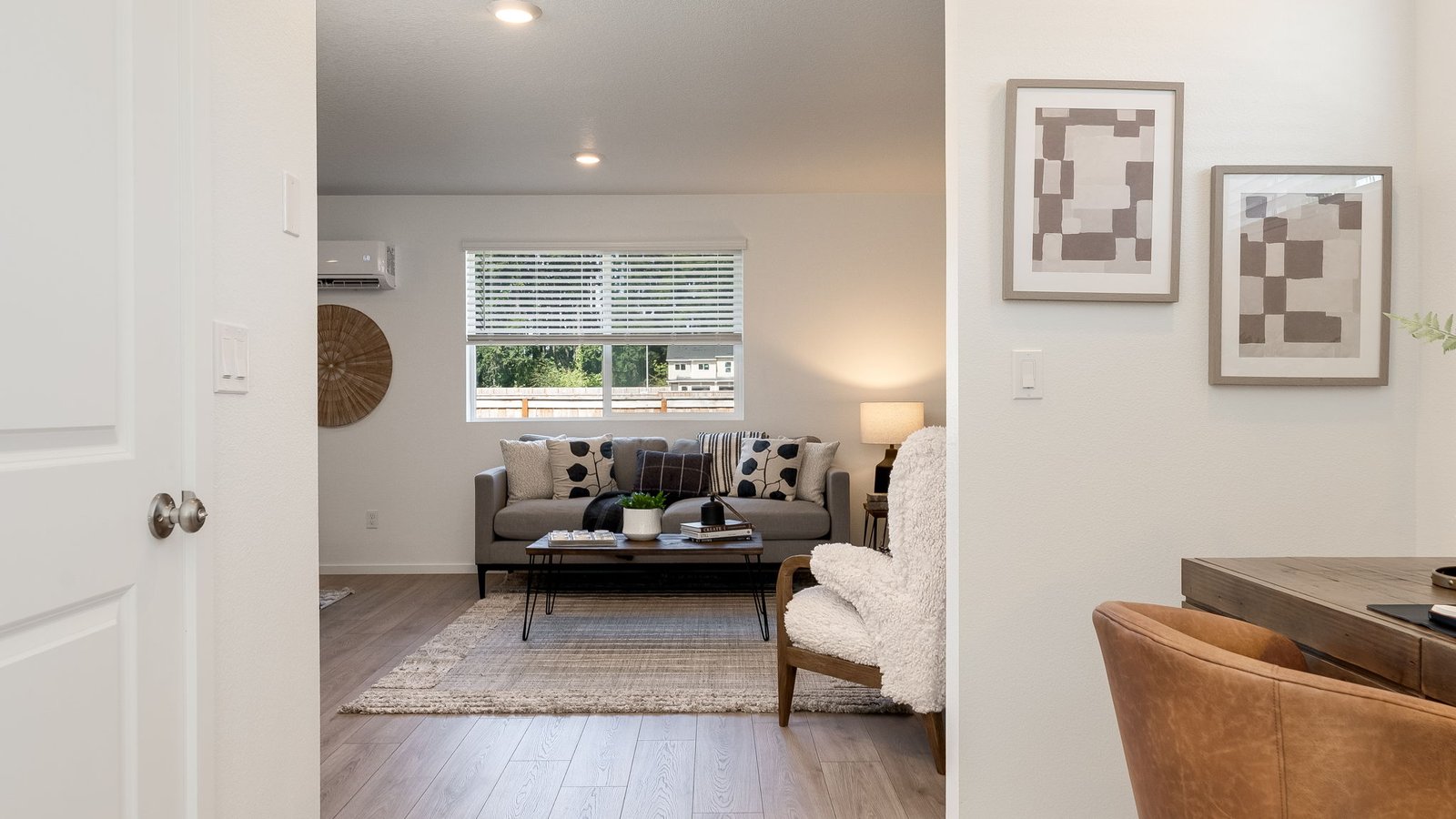 Entryway with a coat closet and laminate flooring