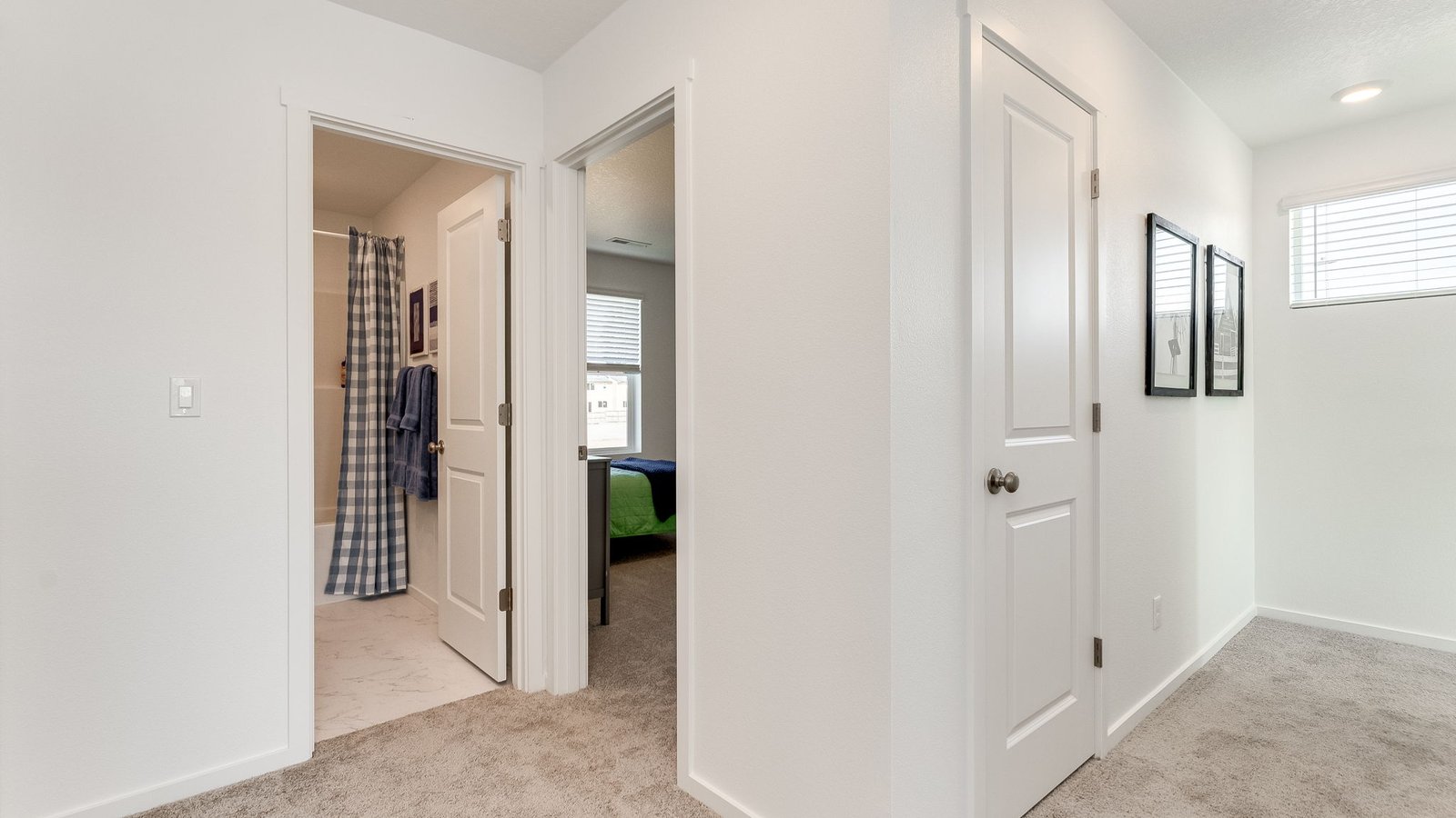 Hallway with wall-to-wall carpet