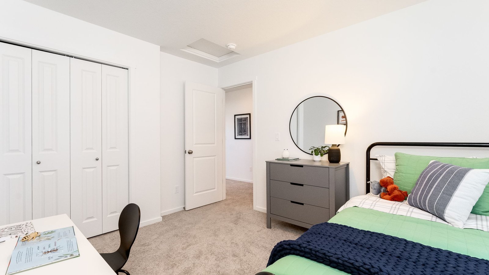 Bedroom with wall-to-wall carpet and a closet