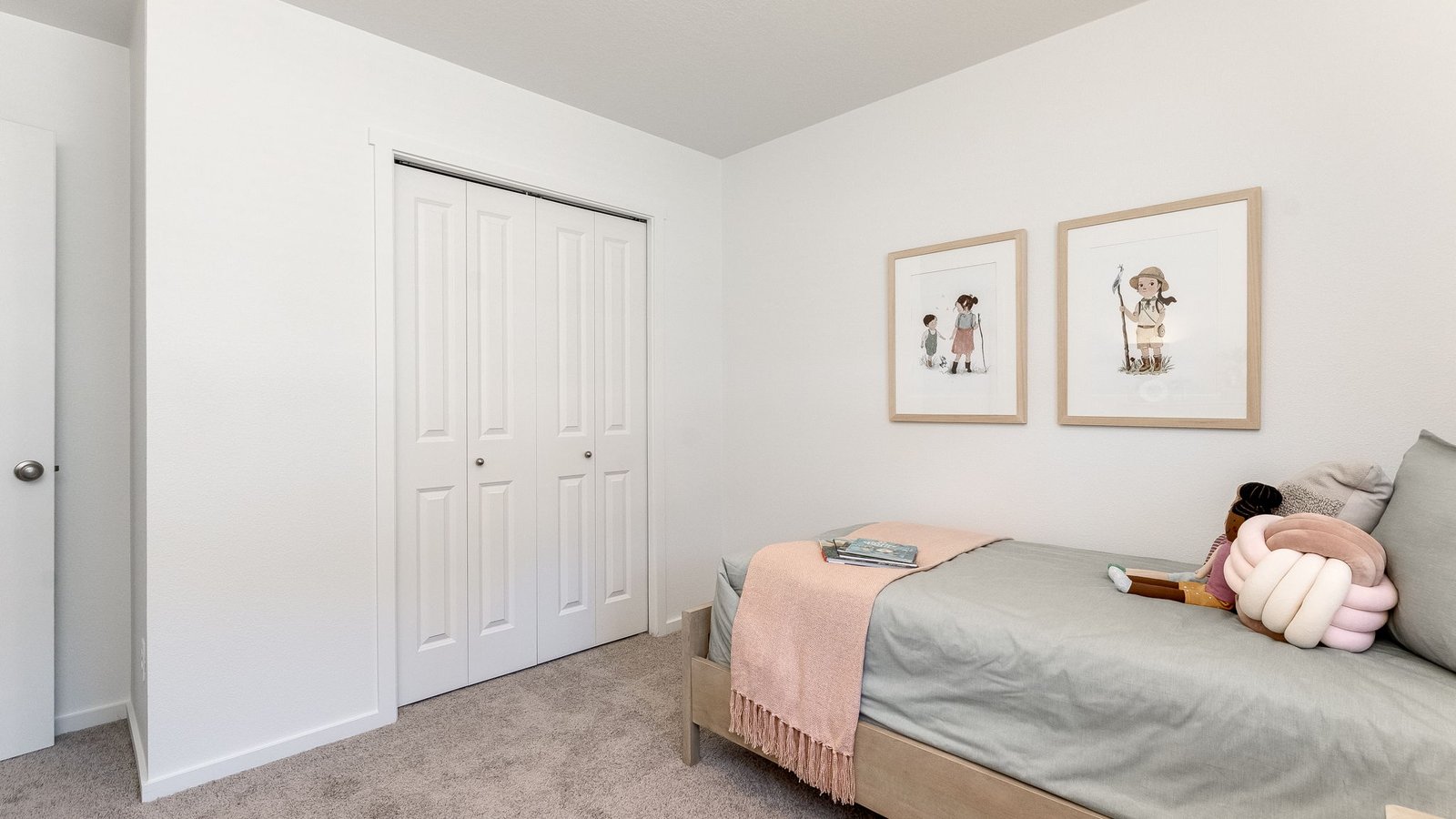 Bedroom with wall-to-wall carpet and a closet