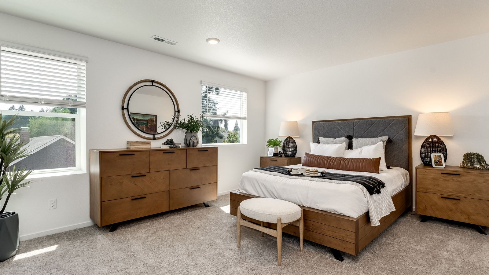 Primary bedroom with wall-to-wall carpet, a walk-in closet and an attached bathroom