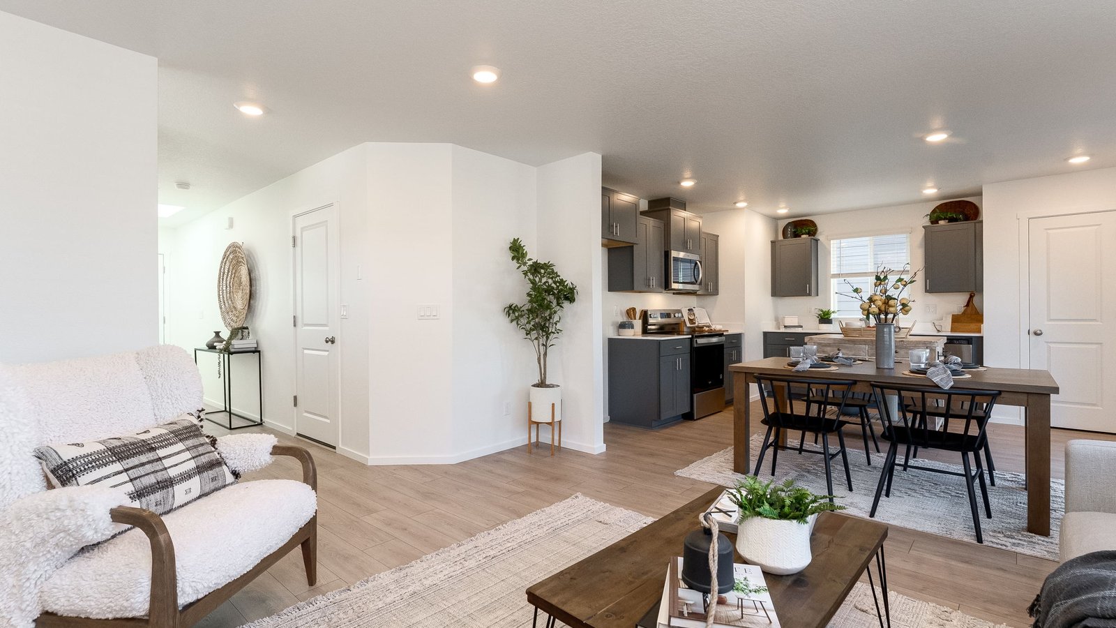 Great room with laminate flooring and an electric fireplace