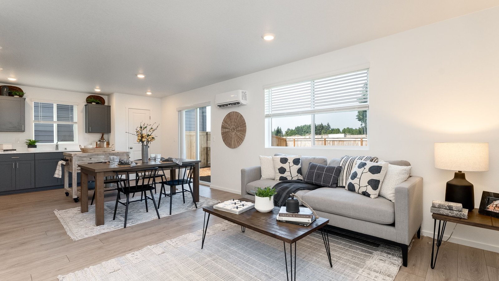 Great room with laminate flooring and an electric fireplace