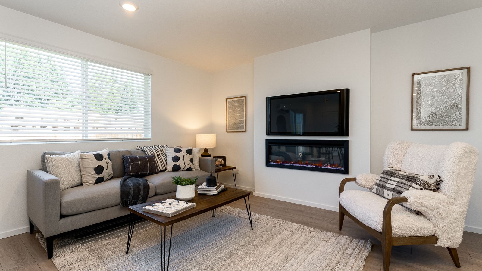 Great room with laminate flooring and an electric fireplace