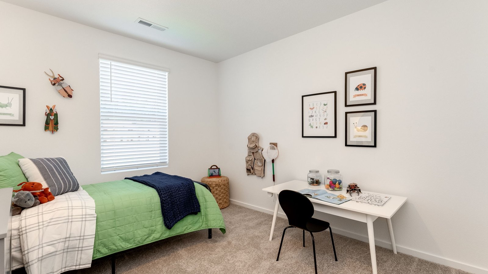 Bedroom with wall-to-wall carpet and a closet