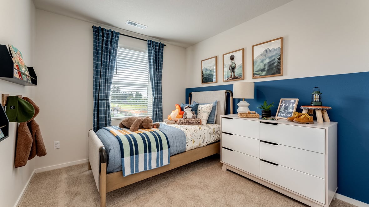 Bedroom with wall-to-wall carpet and a closet