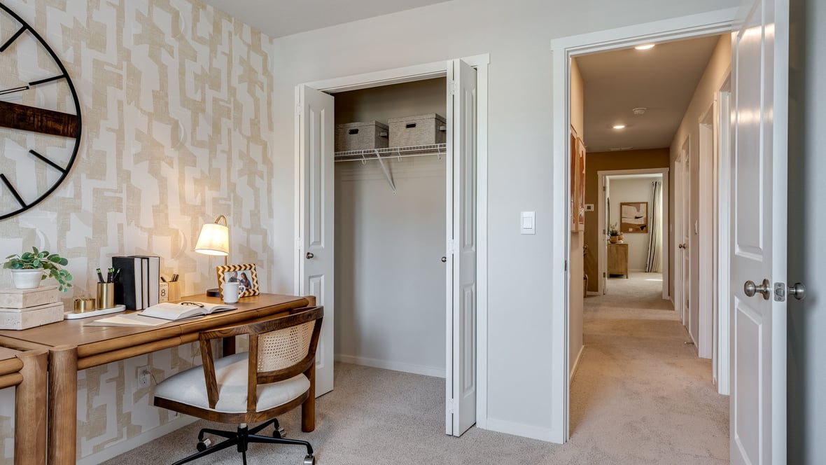 Bedroom with wall-to-wall carpet and a closet