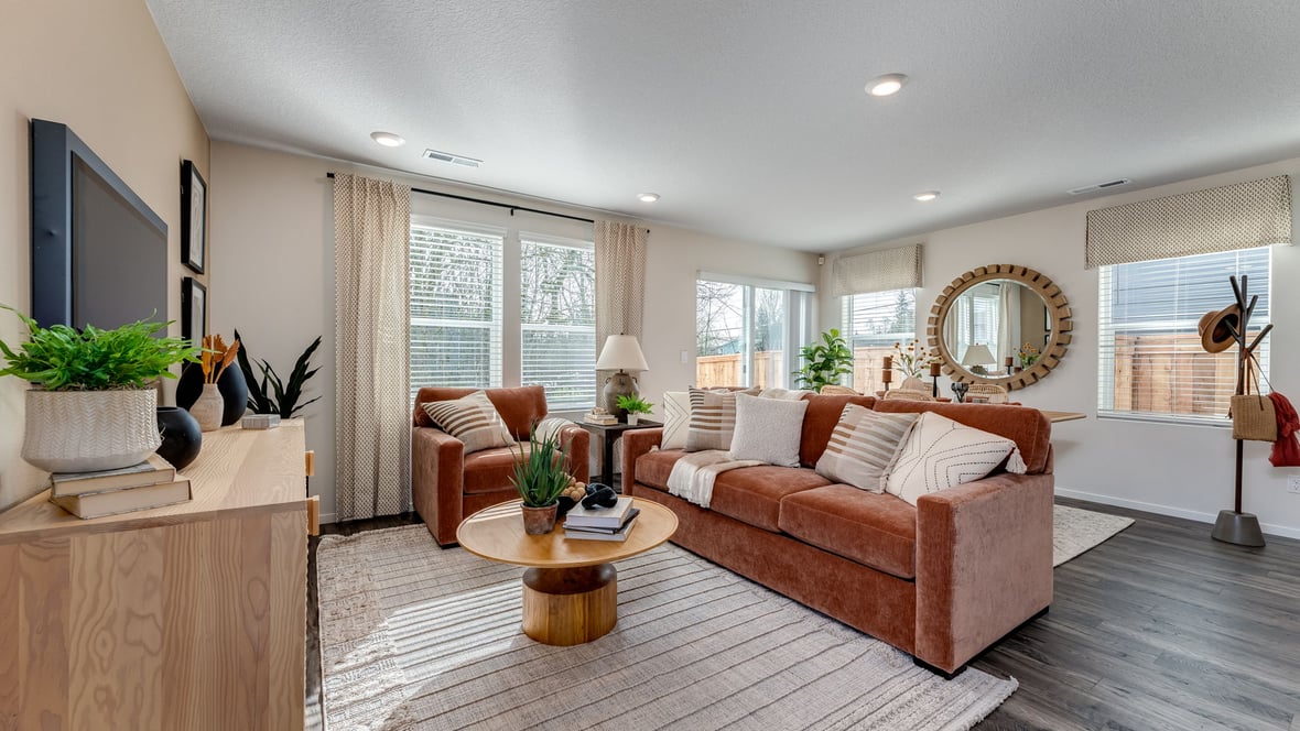 Great room with laminate flooring and an electric fireplace