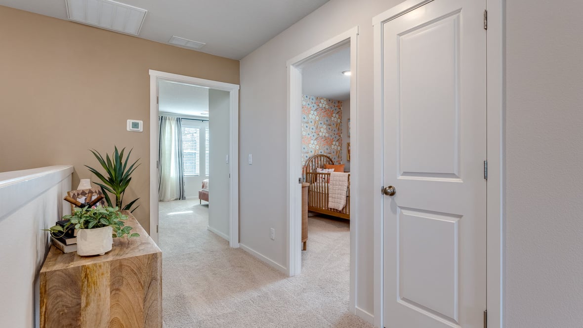 Hallway with wall-to-wall carpet