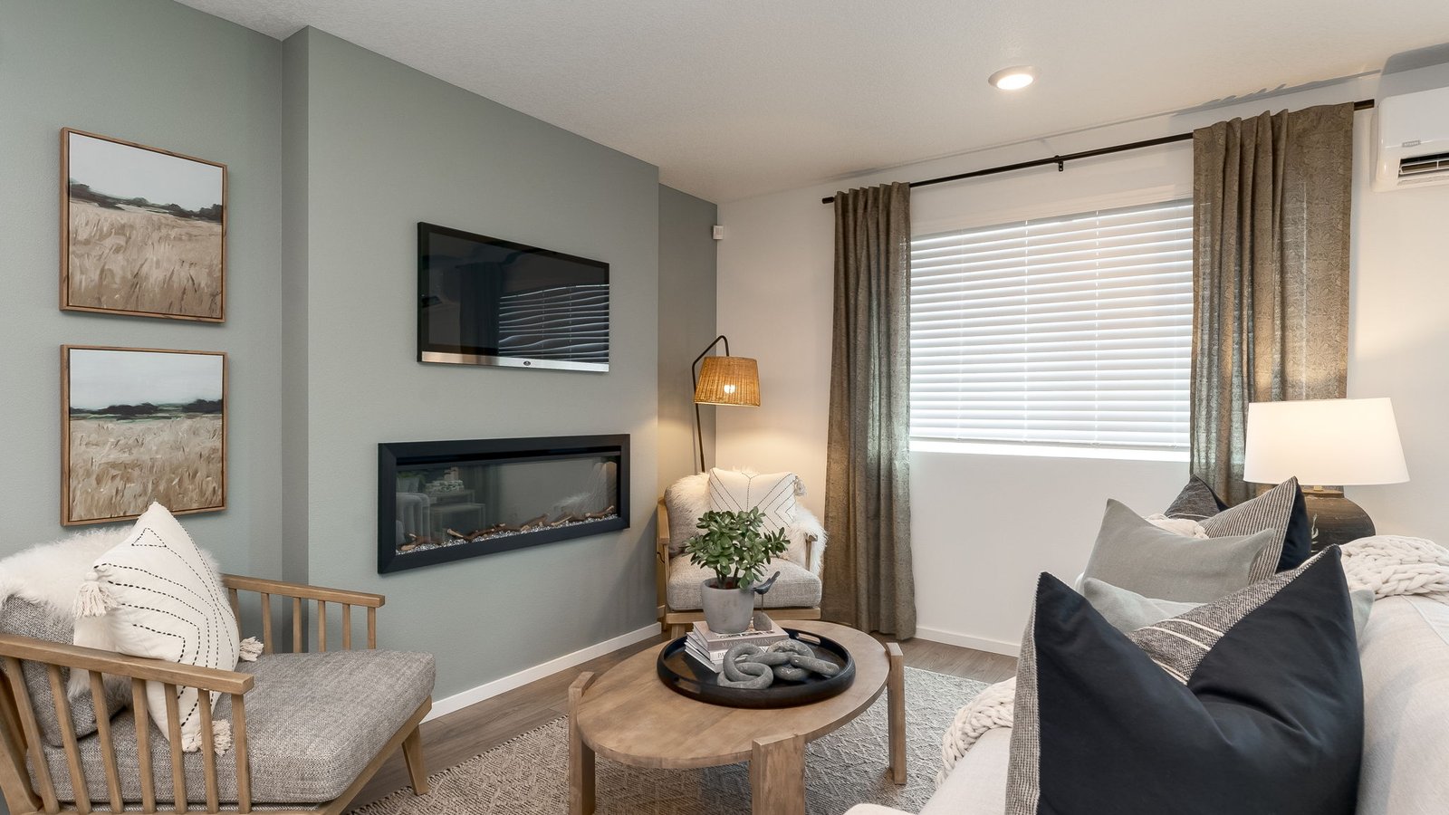 Great room with laminate flooring and an electric fireplace