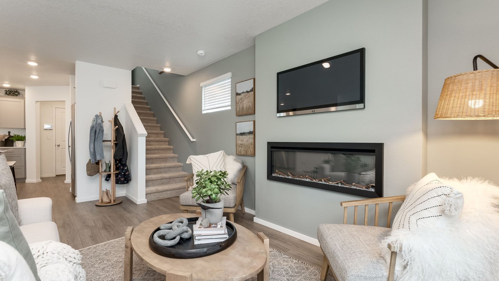 Great room with laminate flooring and an electric fireplace