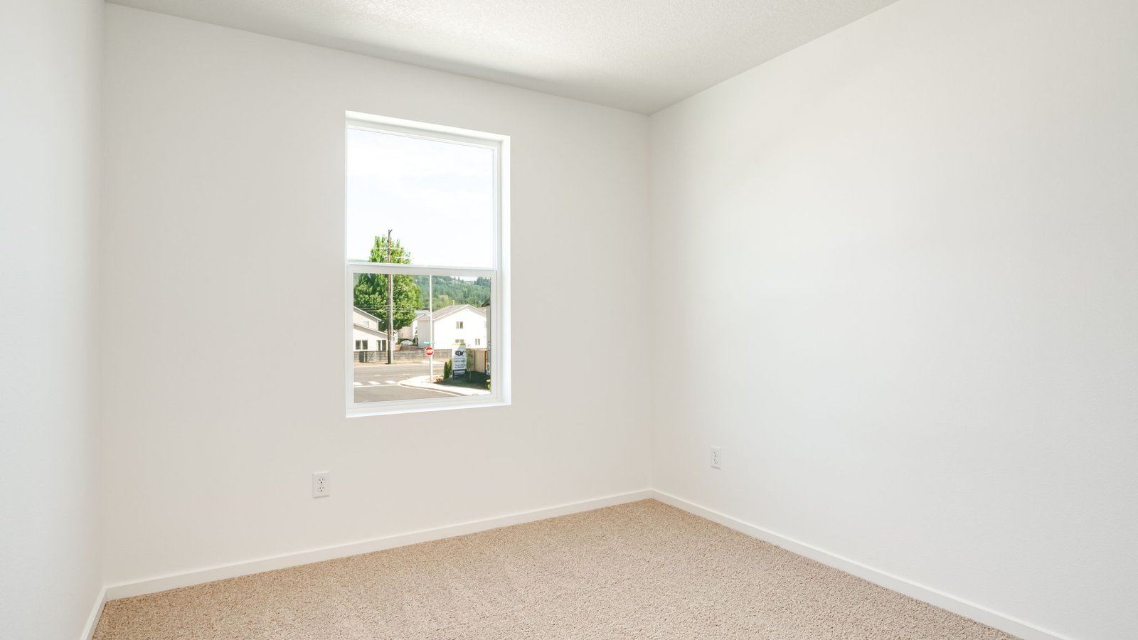 Bedroom with wall-to-wall carpet and a closet