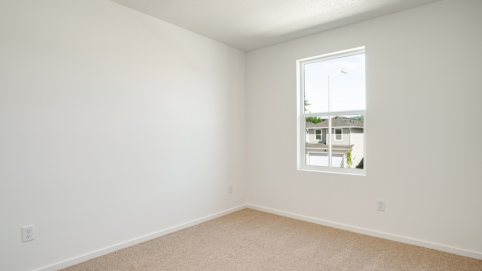 Bedroom with wall-to-wall carpet and a closet