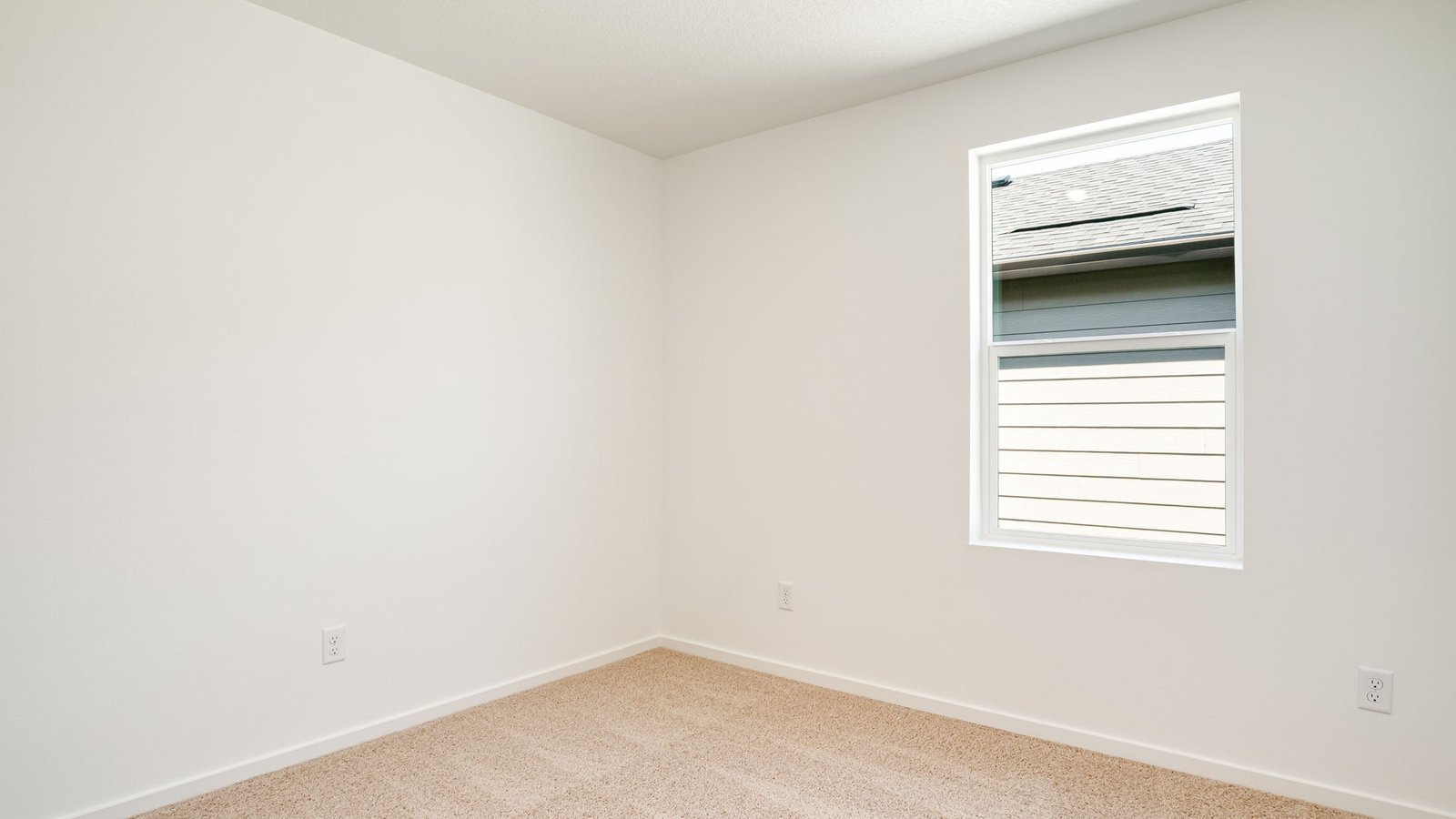 Bedroom with wall-to-wall carpet and a closet
