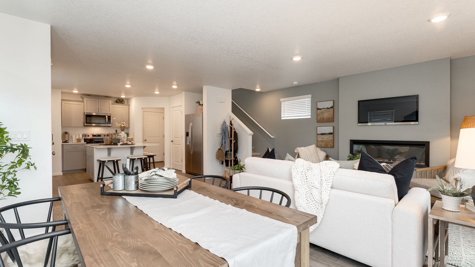 Great room with laminate flooring and an electric fireplace