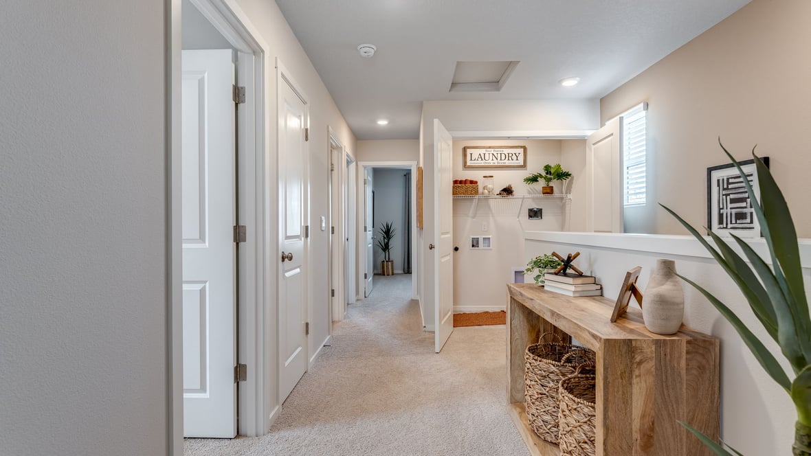 Hallway with wall-to-wall carpet