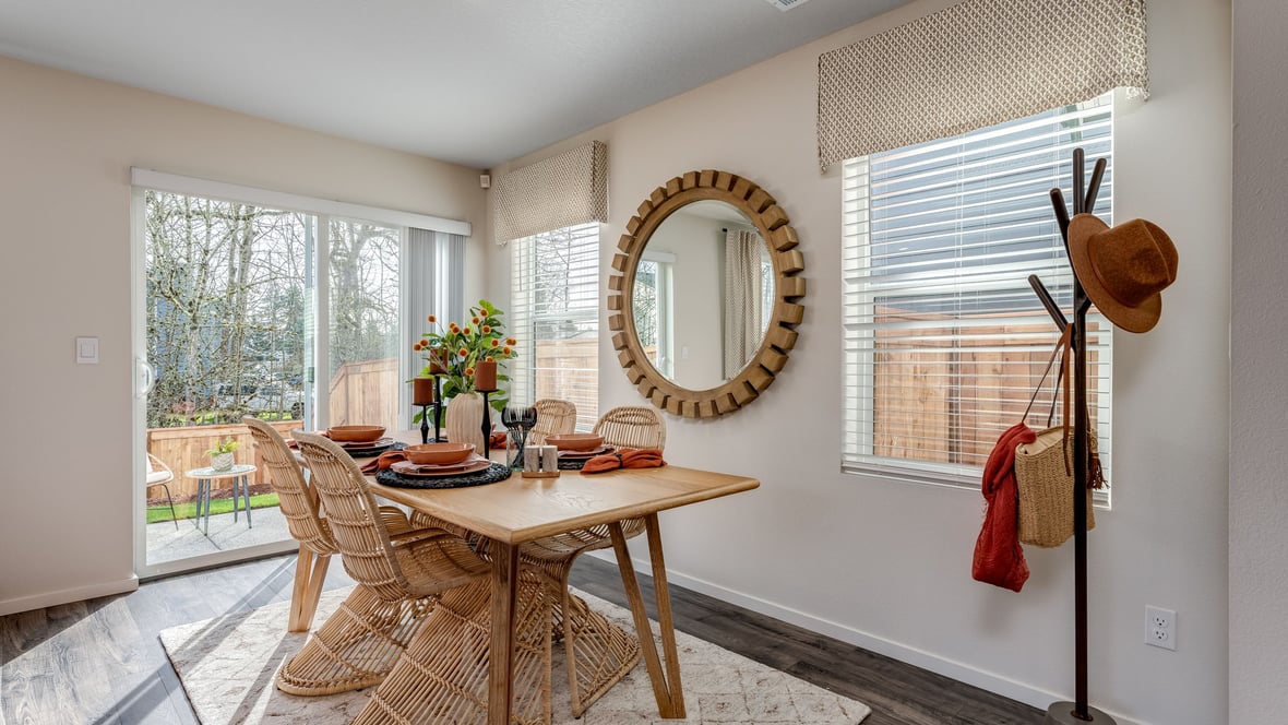 Dining area with a sliding glass door to a fenced backyard