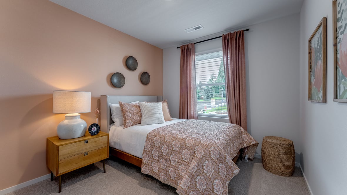 Bedroom with wall-to-wall carpet and a closet