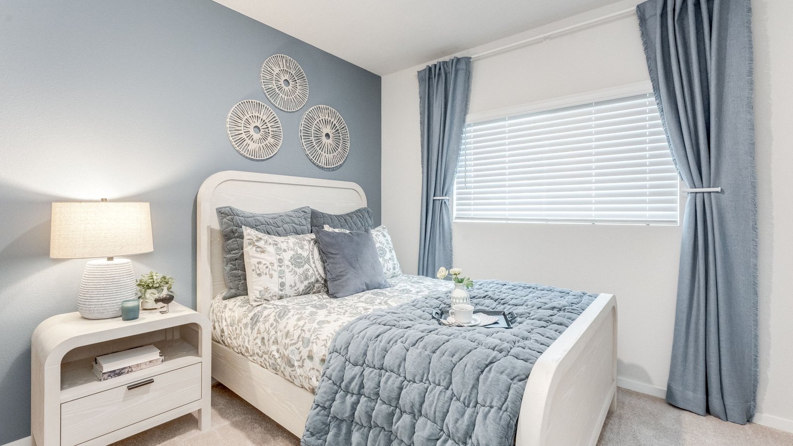 Bedroom with wall-to-wall carpet and a closet