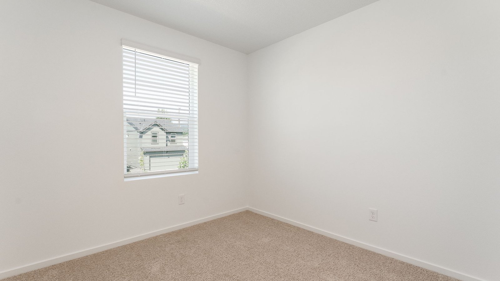 Bedroom with wall-to-wall carpet and a closet