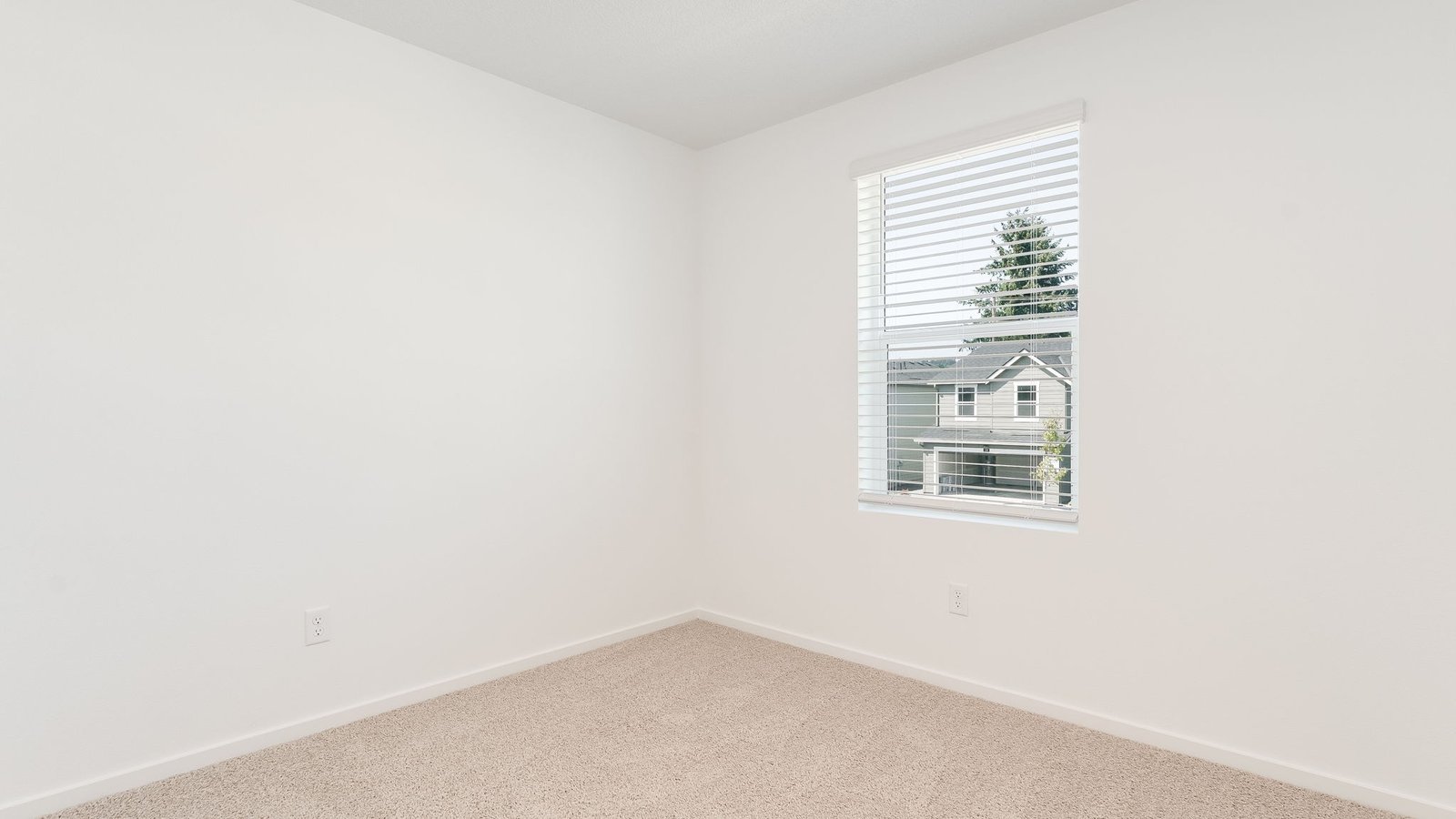 Bedroom with wall-to-wall carpet and a closet