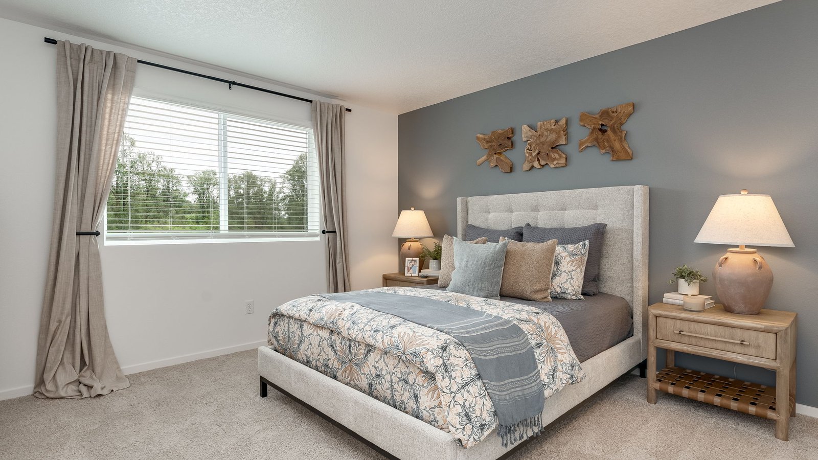 Primary bedroom with wall-to-wall carpet, a walk-in closet and an attached bathroom