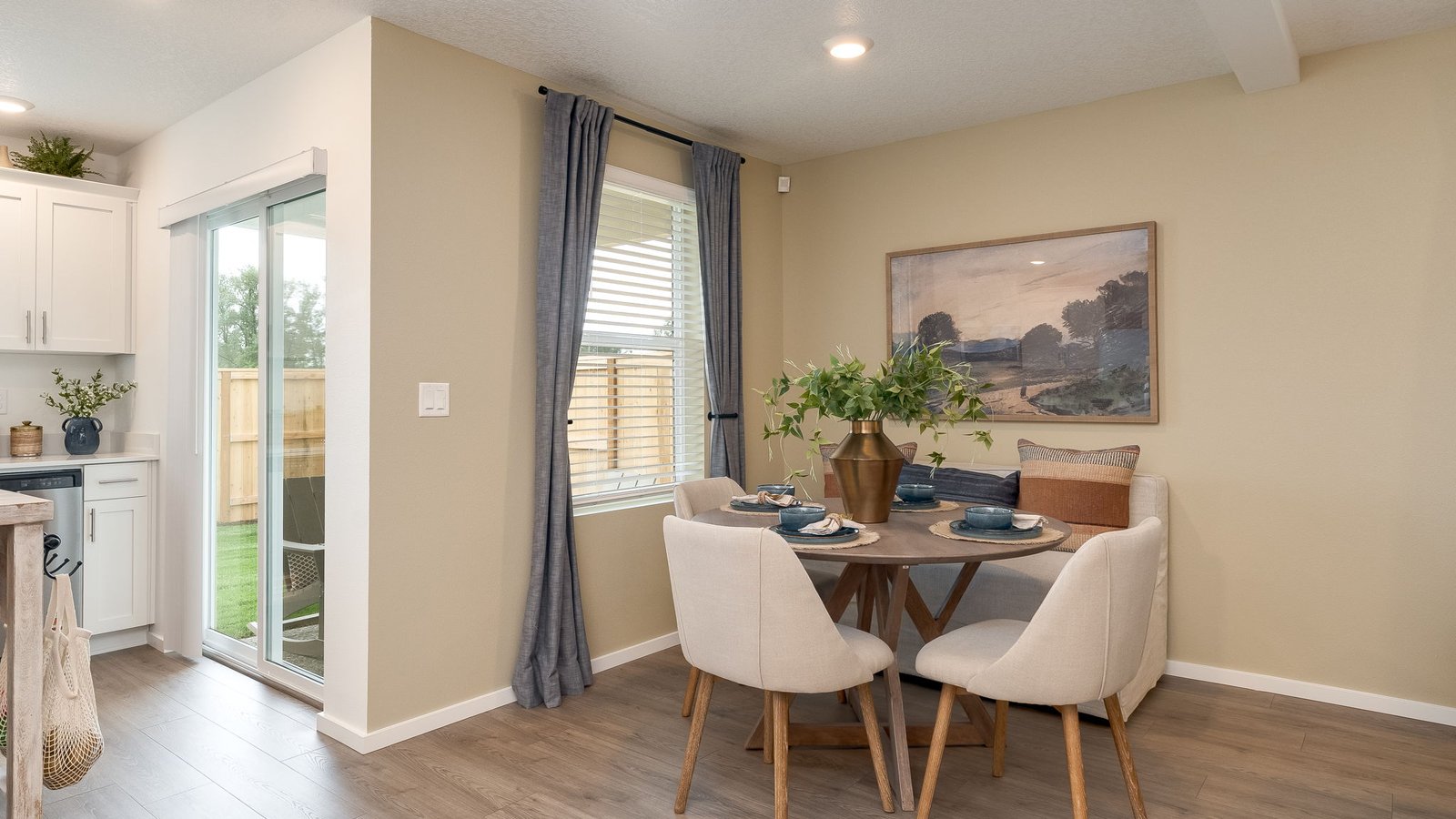 Dining area with a sliding glass door to a fenced backyard