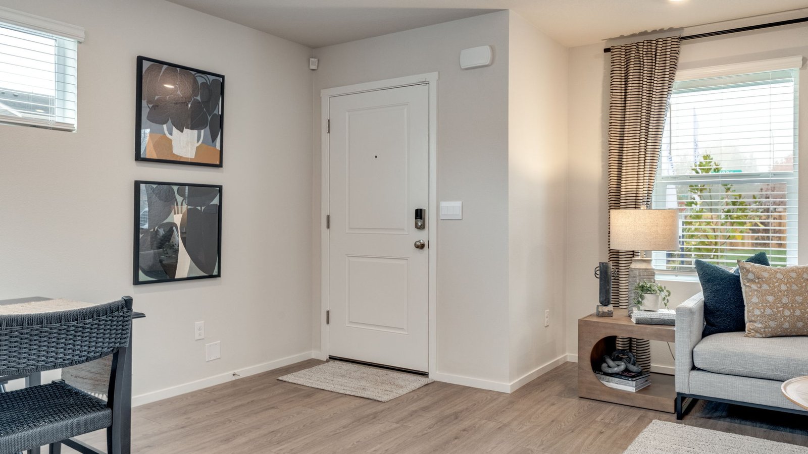 Entryway with a coat closet and laminate flooring
