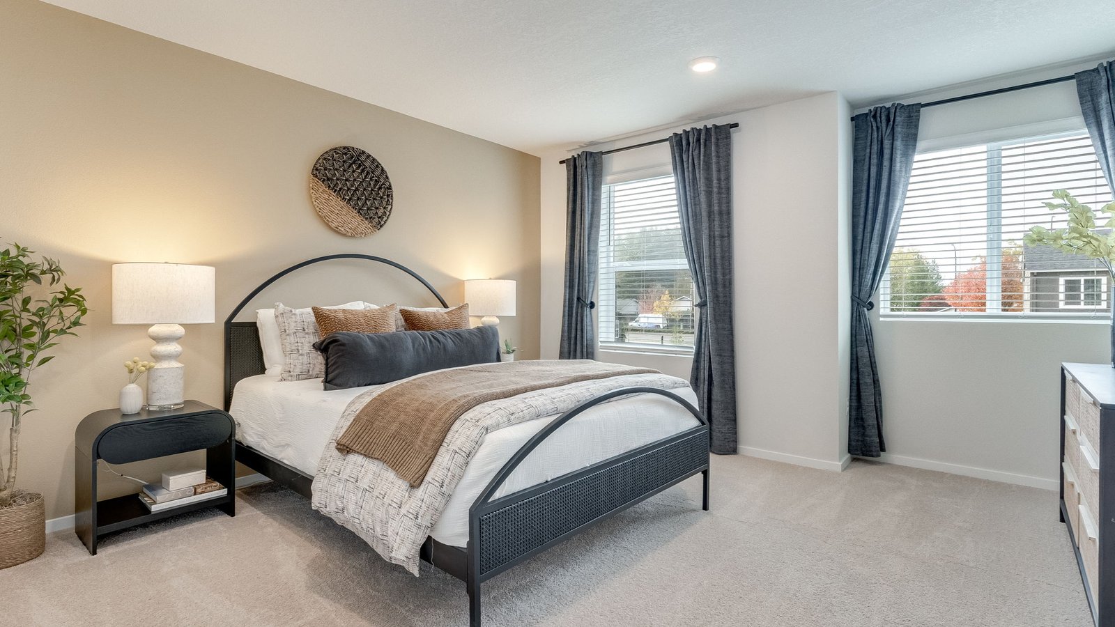 Primary bedroom with wall-to-wall carpet, a walk-in closet and an attached bathroom