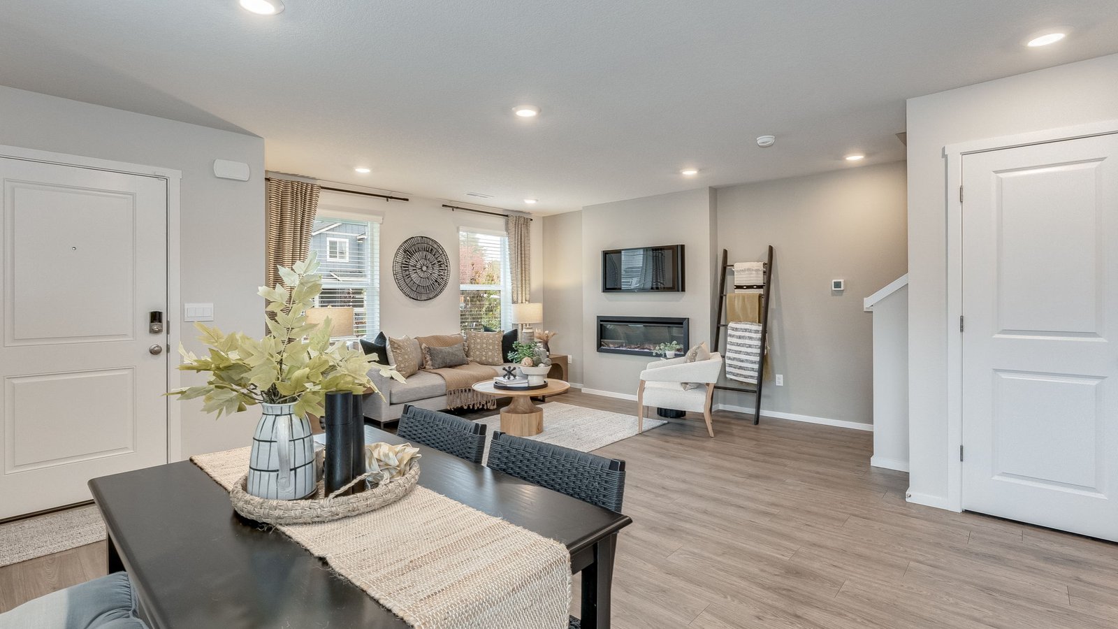 Great room with laminate flooring and an electric fireplace