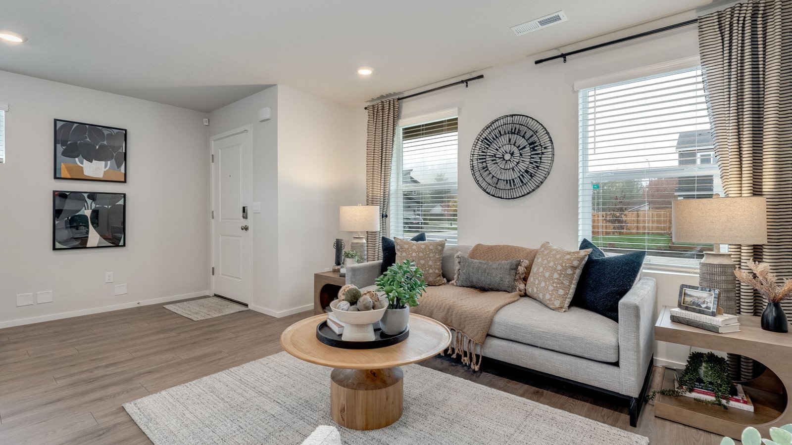 Great room with laminate flooring and an electric fireplace