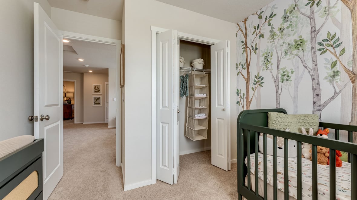 Bedroom with wall-to-wall carpet and a closet