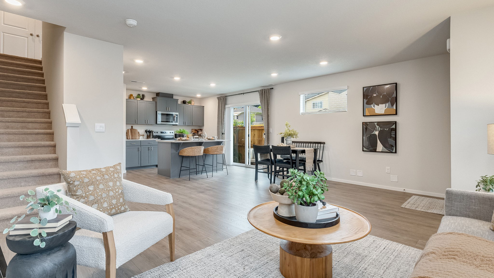 Great room with laminate flooring and an electric fireplace