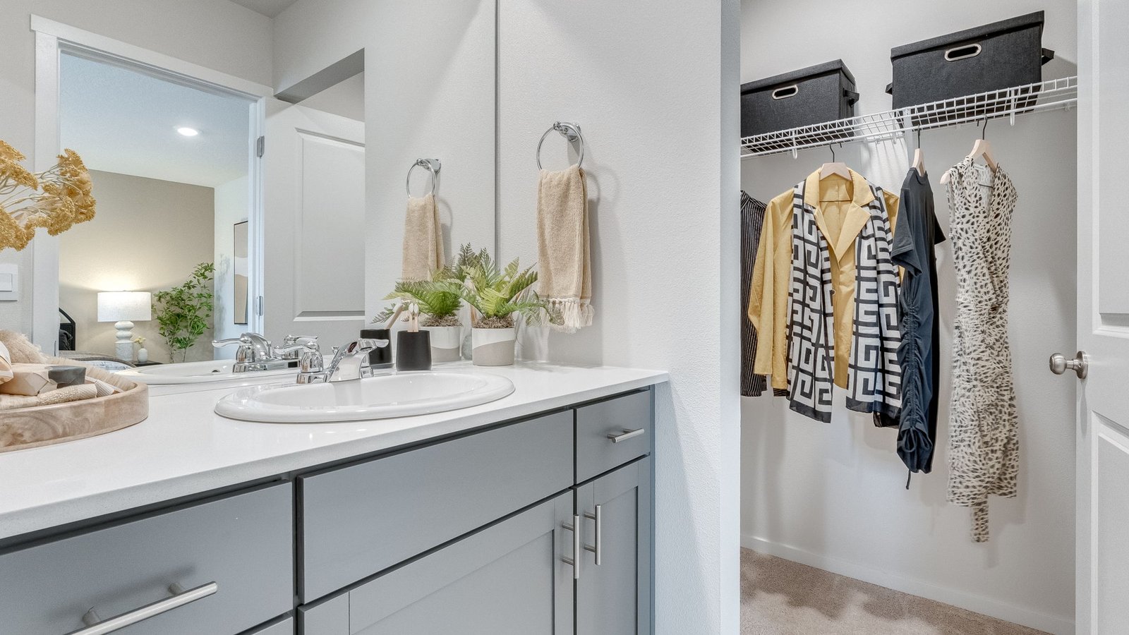 Primary bathroom with quartz counters and a walk-in shower