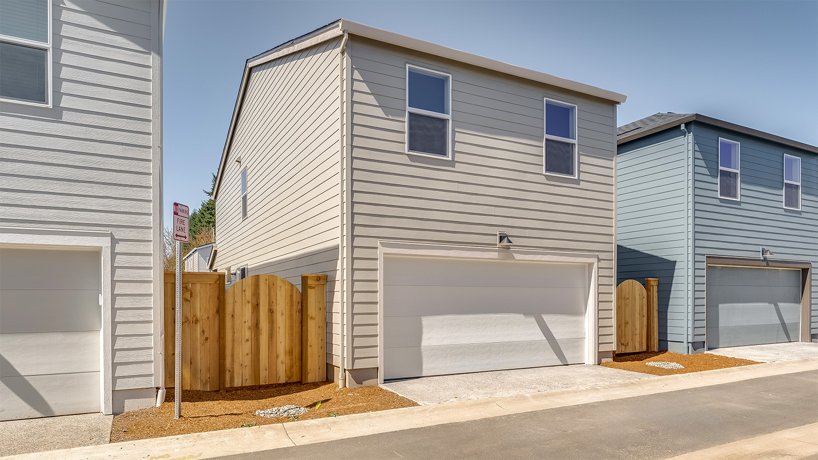 exterior back single-family home with a 2-car garage