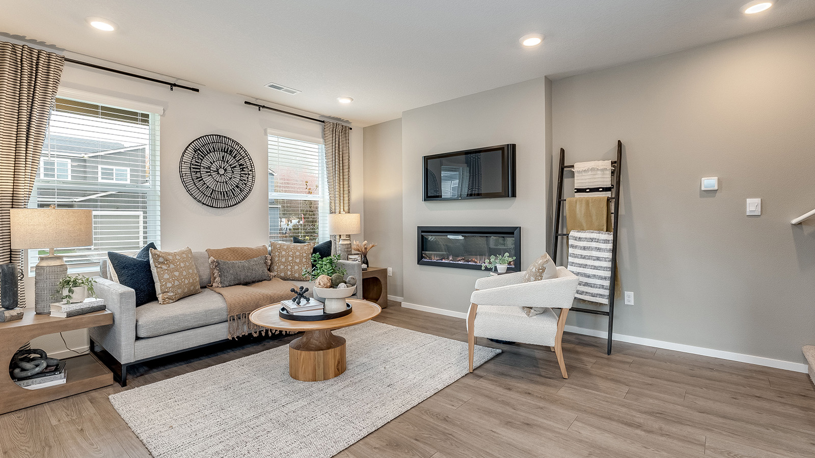 Great room with laminate flooring and an electric fireplace