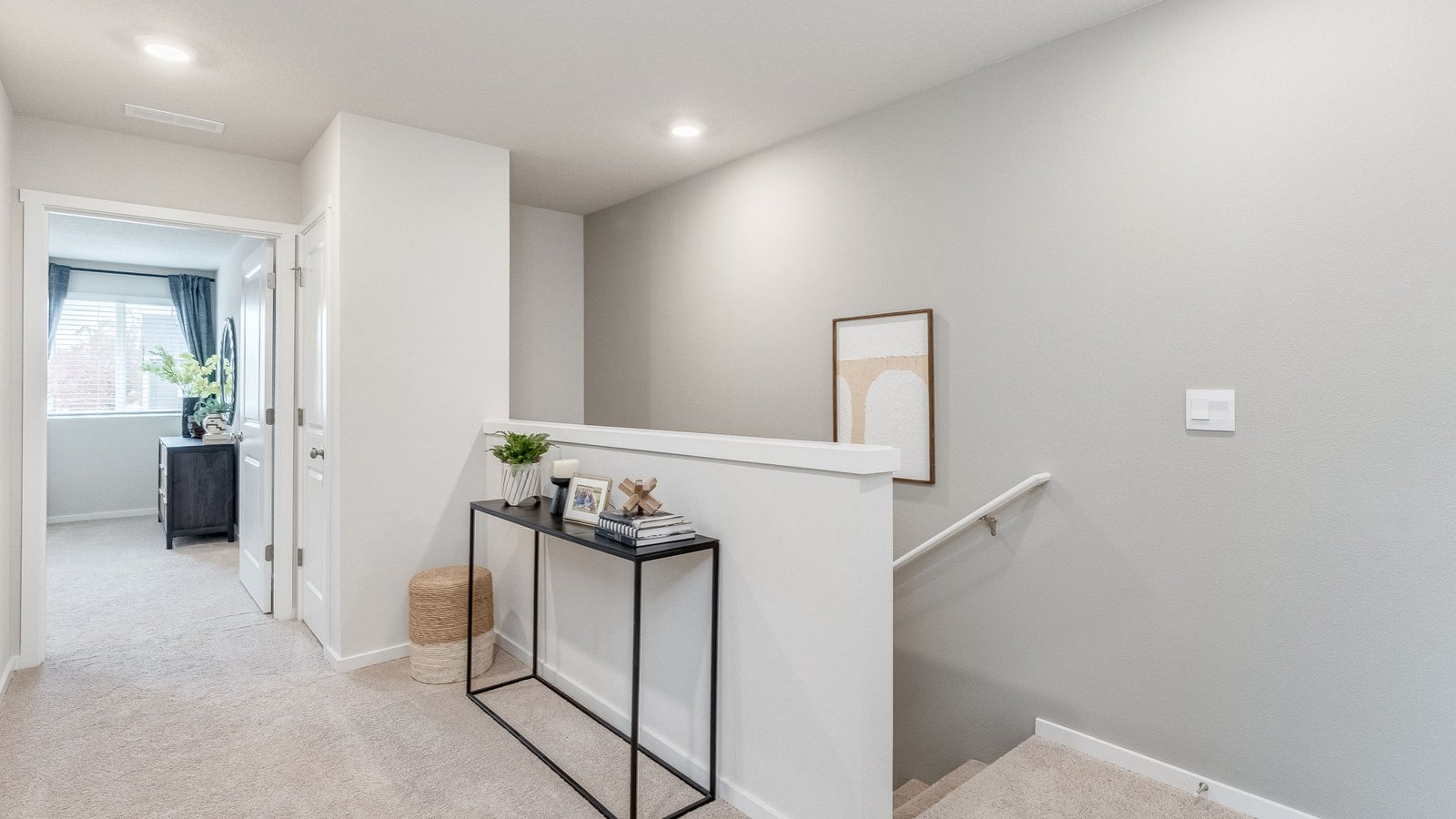Hallway with wall-to-wall carpet