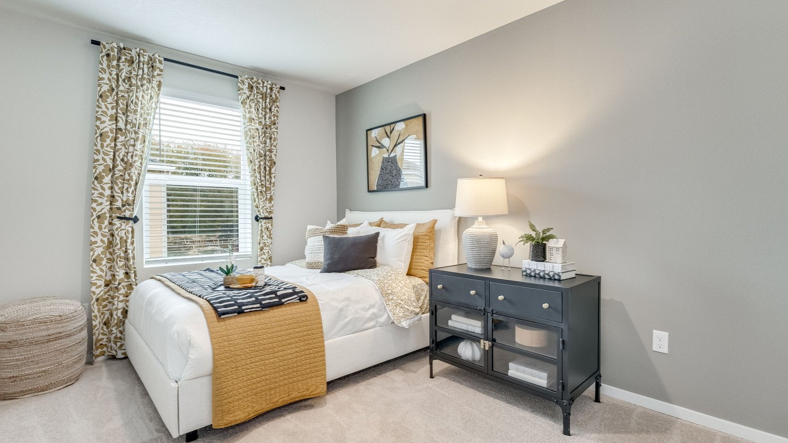 Bedroom with wall-to-wall carpet and a closet